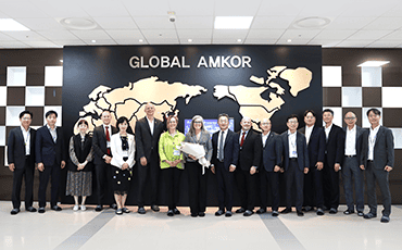 Arizona Governor Katie Hobbs posing for picture with Amkor officials